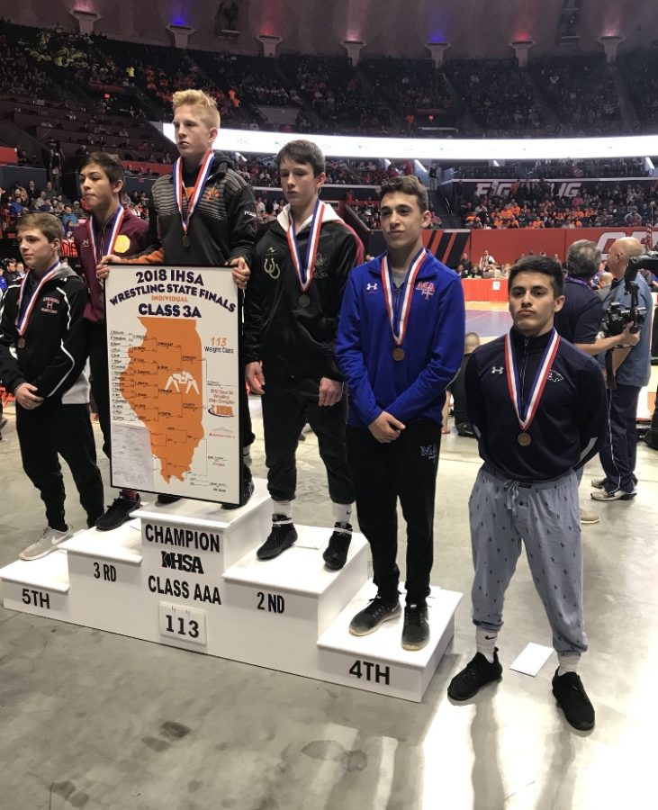 Junior Enzo Silva (right) places sixth in the state in the 113 lb. weight class (3A).