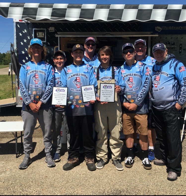 (Middle) Junior Ryan Park and senior Tommy McDonald stand with their teammates after capturing 1st place in the Illinois State Championship held at Clinton Lake, Illinois.