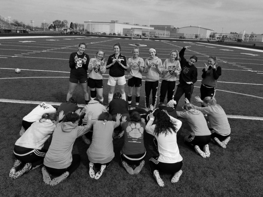 (Left) For the first time in South’s history, the senior class athletes lost to their underclassmen in a team scrimmage. (Right) The team gathers during conditioning at the beginning of the year, before debuting their season start