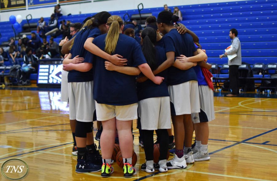 These photos feature last year's team huddle before the game against East.