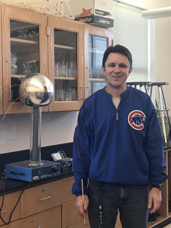 Wittenkeller and stands next to the machine he uses to teach his 
students about the flow of electrons in his classes. 