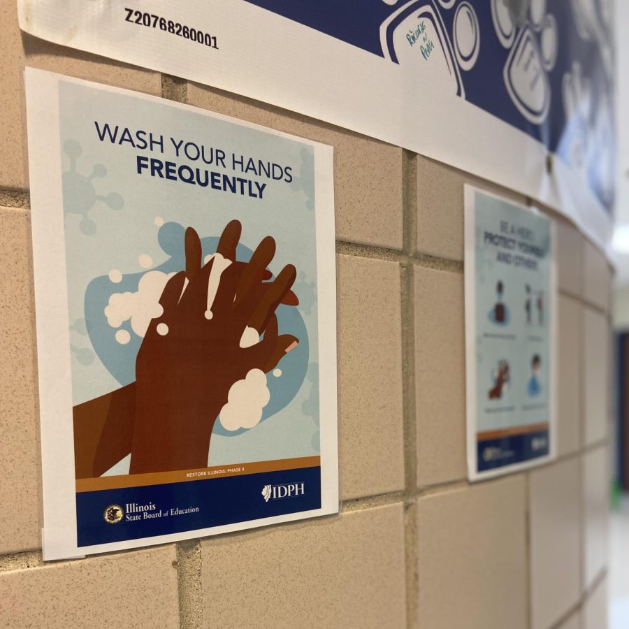Posters that were hung during the transition into hybrid learning last year are still hanging in the hallways, a reminder of how much has happened since. SHIELD Illinois COVID-19 testing is available to students at South per request. The testing consent form is available for parents and students on the Plainfield school district website. 