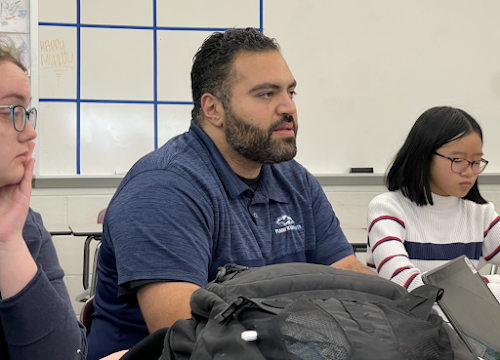 Teacher Ronnie Faraj talks to the Paw Print Staff about his extracurriculars and his love for the students on Nov. 7. “If I can make school fun, if I can help them out with cool ideas, kids are more inclined to come to school. It’s not easy, but it’s doable,” Faraj said, who is currently helping student council prepare for the winter dance. 
