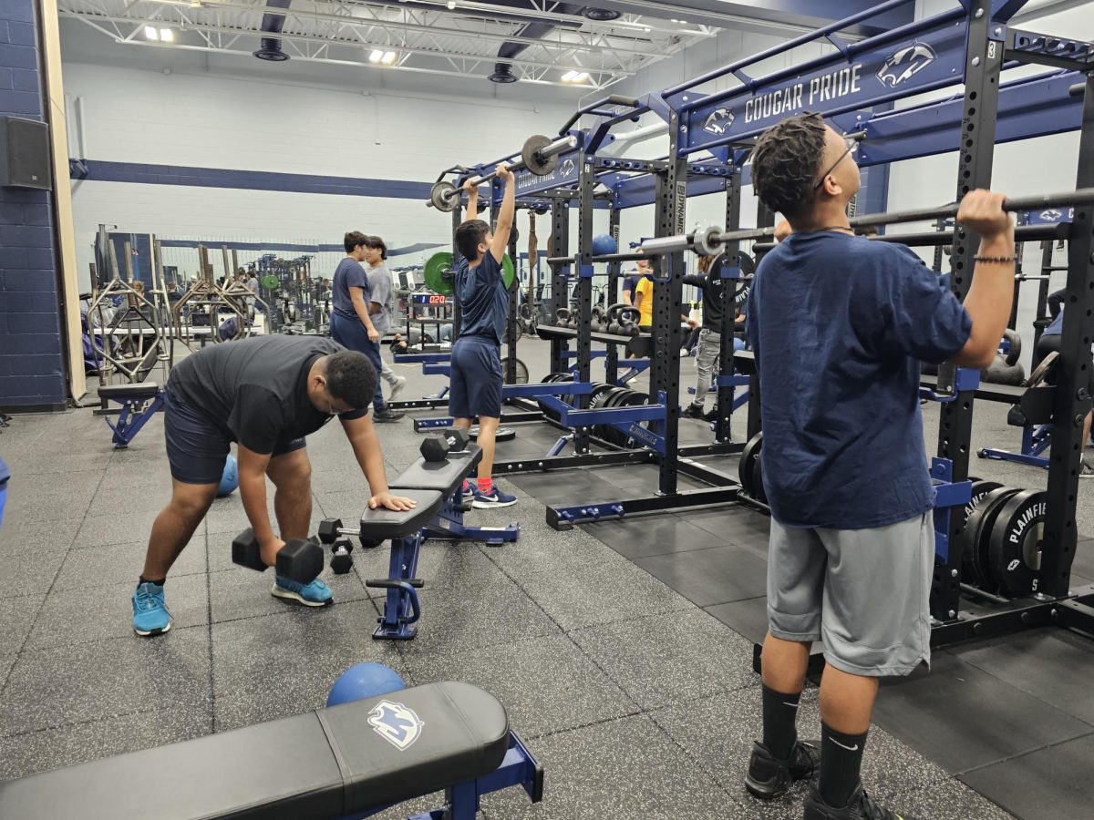 Students in 5th period participate in activities during their weight training class
